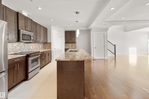 408 1350 Windermere Way, Edmonton, AB - Indoor Photo Showing Kitchen With Stainless Steel Kitchen With Upgraded Kitchen