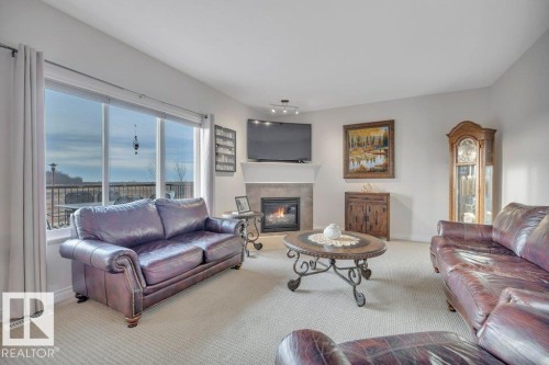 827 Southfork Green, Leduc, AB - Indoor Photo Showing Living Room With Fireplace
