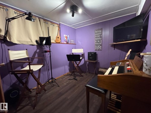 Home office with dark wood-style flooring - 4707 53 Street, Athabasca Town, AB - Indoor