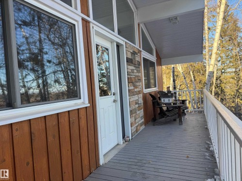 View of wooden terrace - 4707 53 Street, Athabasca Town, AB - Outdoor With Exterior