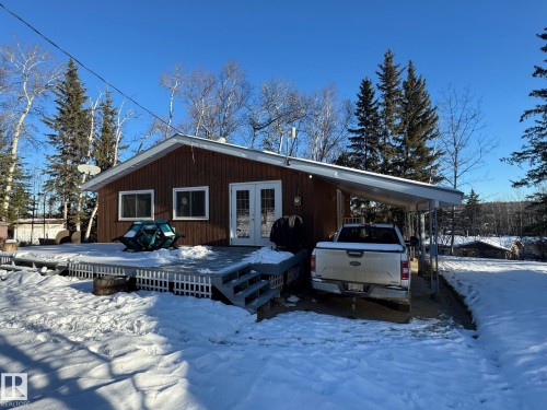 View of front facade with french doors, an attached carport, and a deck - 4707 53 Street, Athabasca Town, AB - Outdoor