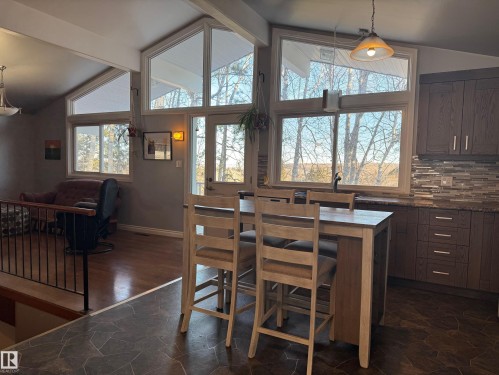 Dining space featuring dark stone finish flooring - 4707 53 Street, Athabasca Town, AB - Indoor Photo Showing Dining Room