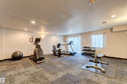 409 151 Edwards Drive Sw, Edmonton, AB - Indoor Photo Showing Gym Room