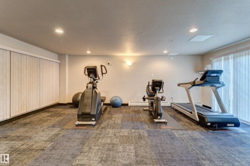 409 151 Edwards Drive Sw, Edmonton, AB - Indoor Photo Showing Gym Room