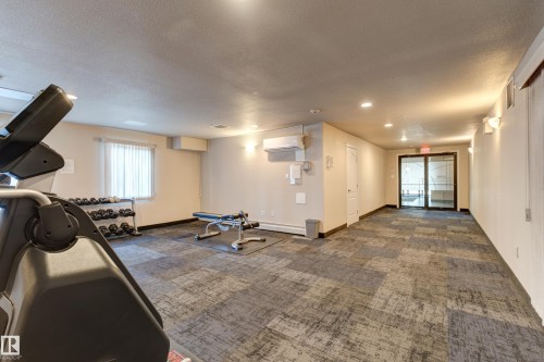 409 151 Edwards Drive Sw, Edmonton, AB - Indoor Photo Showing Gym Room