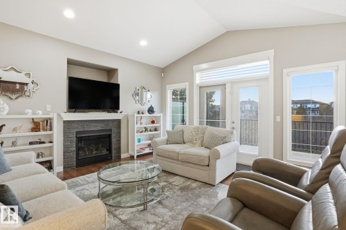 12 3090 Cameron Heights Way, Edmonton, AB - Indoor Photo Showing Living Room With Fireplace