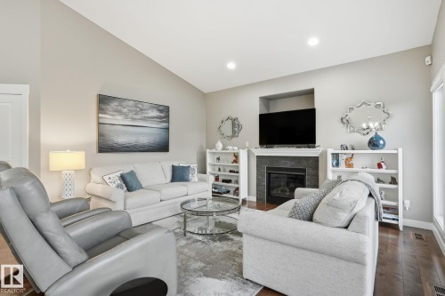 12 3090 Cameron Heights Way, Edmonton, AB - Indoor Photo Showing Living Room With Fireplace