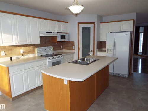 29 Meadowview Drive, Leduc, AB - Indoor Photo Showing Kitchen With Double Sink