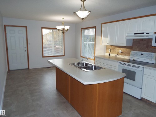 29 Meadowview Drive, Leduc, AB - Indoor Photo Showing Kitchen With Double Sink