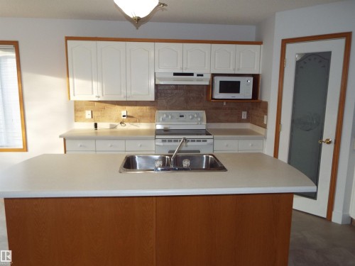29 Meadowview Drive, Leduc, AB - Indoor Photo Showing Kitchen With Double Sink