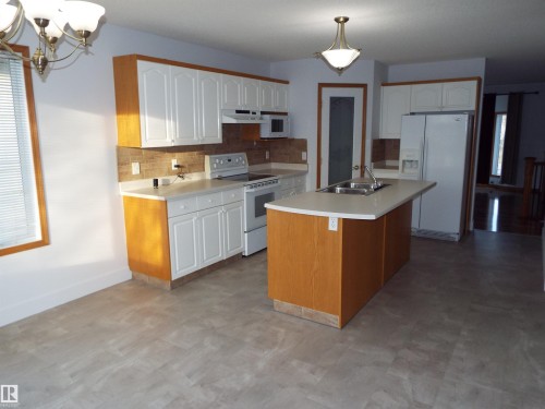 29 Meadowview Drive, Leduc, AB - Indoor Photo Showing Kitchen With Double Sink