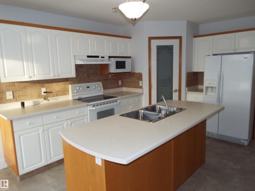 29 Meadowview Drive, Leduc, AB - Indoor Photo Showing Kitchen With Double Sink