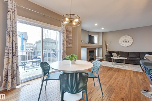 1930 Chapman Road, Edmonton, AB - Indoor Photo Showing Dining Room With Fireplace