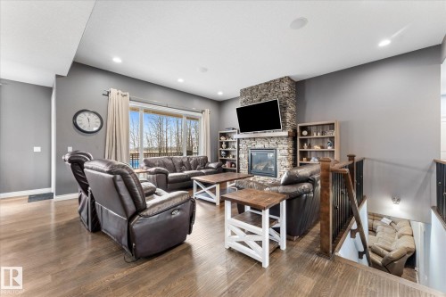 102 3510 Ste. Anne Trail, Rural Lac Ste. Anne County, AB - Indoor Photo Showing Living Room With Fireplace