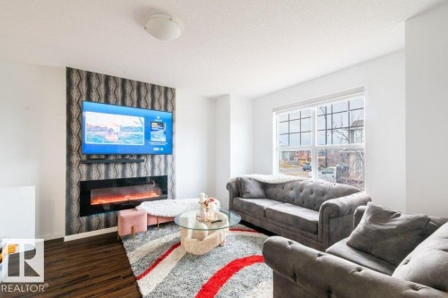 2031 52 Street Sw, Edmonton, AB - Indoor Photo Showing Living Room With Fireplace