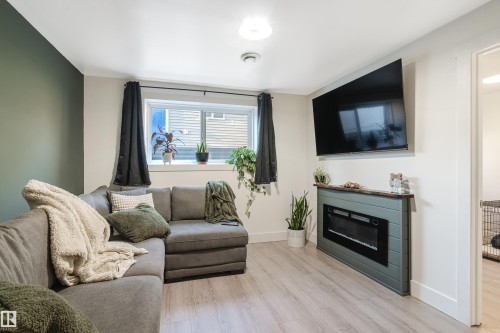 4134 51 Street, Gibbons, AB - Indoor Photo Showing Living Room With Fireplace
