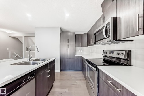 23 2922 Maple Way, Edmonton, AB - Indoor Photo Showing Kitchen With Stainless Steel Kitchen With Double Sink With Upgraded Kitchen