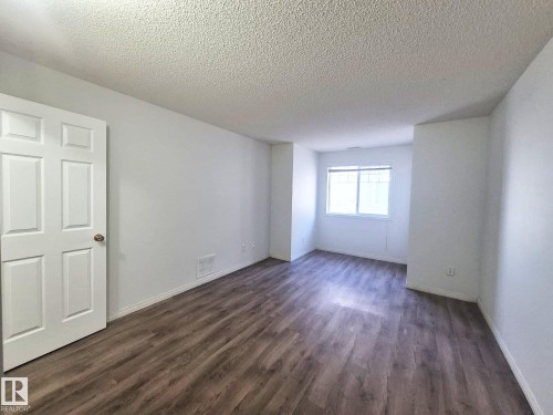 201 164 Bridgeport Boulevard, Leduc, AB - Indoor Photo Showing Other Room