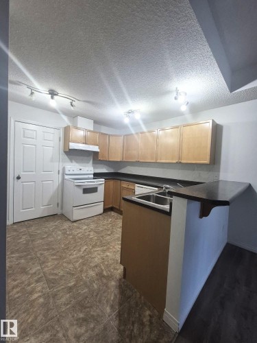 201 164 Bridgeport Boulevard, Leduc, AB - Indoor Photo Showing Kitchen