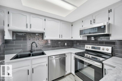 13618 27 Street Nw, Edmonton, AB - Indoor Photo Showing Kitchen With Double Sink