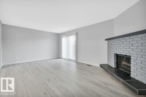 13618 27 Street Nw, Edmonton, AB - Indoor Photo Showing Living Room With Fireplace