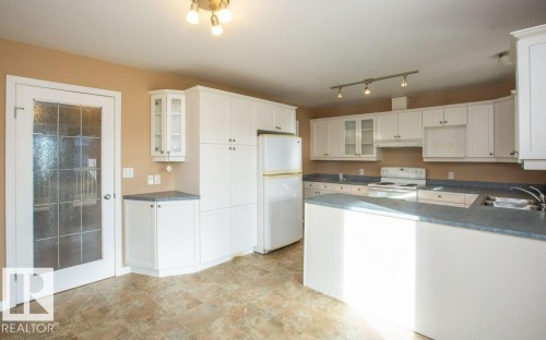 11107 103 Street, Westlock, AB - Indoor Photo Showing Kitchen With Double Sink