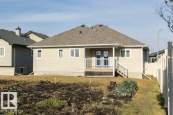 Back of property featuring roof with shingles - 