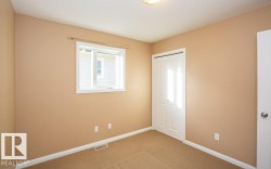 Unfurnished bedroom with a closet and carpet - 