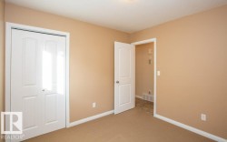 Unfurnished bedroom featuring carpet floors and a closet - 