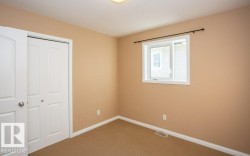 Unfurnished bedroom featuring carpet floors and a closet - 