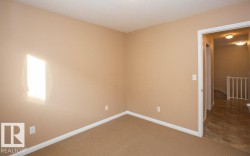 Carpeted empty room with baseboards - 