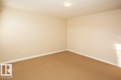 Spare room with baseboards and carpet flooring - 