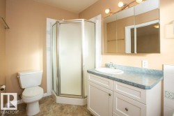 Full bath with a shower stall and vanity - 