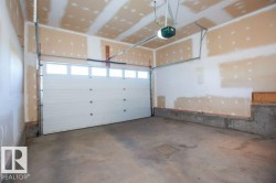 Garage featuring a garage door opener - 