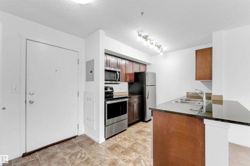 316 3211 James Mowatt Trail, Edmonton, AB - Indoor Photo Showing Kitchen With Double Sink