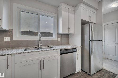 169 Robinson Drive, Leduc, AB - Indoor Photo Showing Kitchen With Stainless Steel Kitchen With Double Sink
