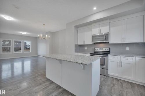 169 Robinson Drive, Leduc, AB - Indoor Photo Showing Kitchen With Stainless Steel Kitchen With Upgraded Kitchen