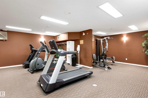 Steps away from the unit - 111 5951 165 Avenue, Edmonton, AB - Indoor Photo Showing Gym Room