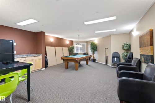 Playroom with billiards table located steps away - 111 5951 165 Avenue, Edmonton, AB - Indoor Photo Showing Other Room