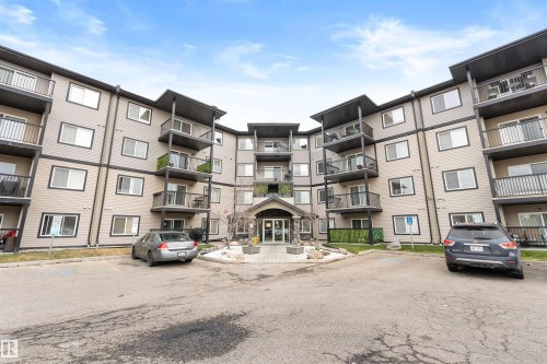 View of apartment building / complex featuring uncovered parking - 111 5951 165 Avenue, Edmonton, AB - Outdoor With Facade
