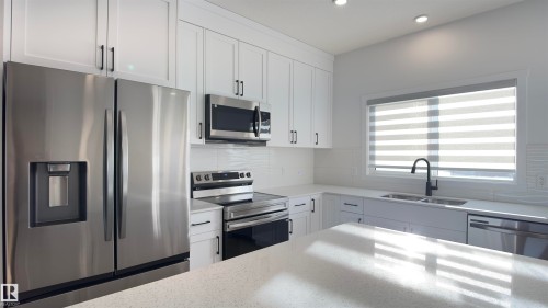 2251 Alces Drive, Edmonton, AB - Indoor Photo Showing Kitchen With Double Sink With Upgraded Kitchen