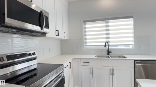 2251 Alces Drive, Edmonton, AB - Indoor Photo Showing Kitchen With Double Sink
