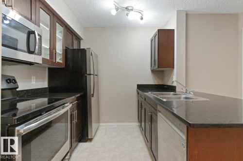 110 12035 22 Avenue Sw, Edmonton, AB - Indoor Photo Showing Kitchen With Stainless Steel Kitchen With Double Sink