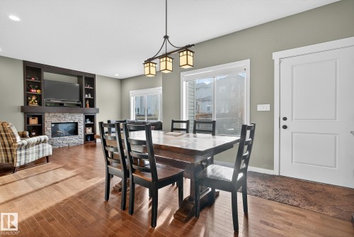 6121 175A Avenue, Edmonton, AB - Indoor Photo Showing Dining Room With Fireplace