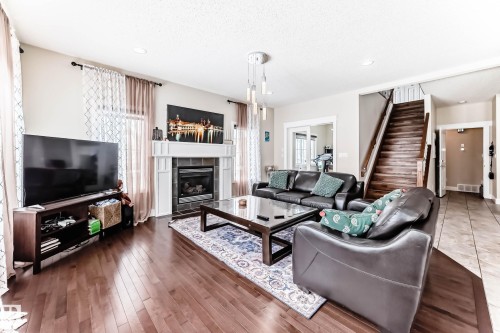 6159 12 Avenue Sw, Edmonton, AB - Indoor Photo Showing Living Room With Fireplace