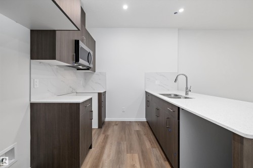 9107 Elves Loop, Edmonton, AB - Indoor Photo Showing Kitchen With Double Sink