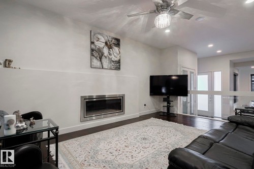 1116 Hainstock Green Green, Edmonton, AB - Indoor Photo Showing Living Room With Fireplace