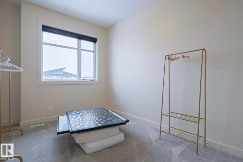 1116 Hainstock Green Green, Edmonton, AB - Indoor Photo Showing Other Room