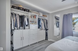 Bedroom with a closet, light wood-style flooring, and ceiling fan - 
