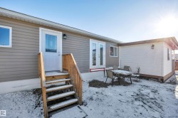 Snow covered property entrance featuring french doors and a patio - 